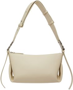 Buffed leather shoulder bag in off-white. · Adjustable and detachable shoulder strap · Logo stamp at face · Zip closure · Patch pocket at interior · Faux-suede lining · Logo-engraved silver-tone hardware · H6 x W10.5 x D4.5 Supplier color: Cream Cream Handbag, Off White Bag, White Bean, Silver Engraving, White Beans, Logo Stamp, Bean Bag, White Bag, Fashion Handbags