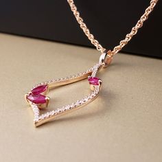 "** Vintage Inspired Ruby & Diamond Pendant** This amazing Ruby pendant is featuring three marquise cut Genuine Rubies (totaling .36cts) and surrounded on all sides by a Sparkling Bright Natural Diamonds (total Diamond weight is .20cts), all set in glowing 14k Rose Gold, hanging from an 18\" 14k Rose Gold chain. This beautiful Pendant has perfectly matching Earrings. **This listing includes the 18\" Loose Rope Chain. **Ruby is the official July Birthstone **Diamond is the official April Birt Rose Gold Teardrop Ruby Jewelry, 14k Rose Gold Fine Jewelry For Valentine's Day, Pink Ruby Marquise Jewelry, Pink Marquise Ruby Jewelry, Rose Gold Marquise Gemstone Jewelry, Rose Gold Ruby Jewelry With Diamond Accents, Ruby Diamond Pendant, Diamond Pendants, Ruby Pendant