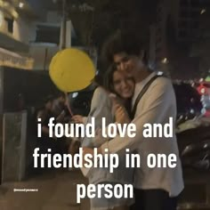 a man and woman hugging each other with a yellow balloon in front of them that says, i found love and friendship in one person