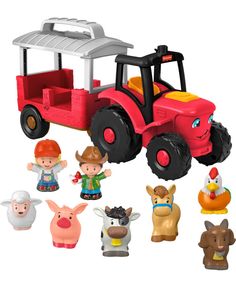 a red toy tractor with farm animals around it