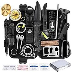 an assortment of tools in a black case on a white background, including scissors and other items