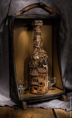 a bottle that is sitting inside of a frame