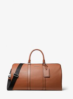 The pebbled leather Cooper duffel bag is a smart investment for overnight trips and short breaks. Its fully-lined interior is sized to hold clothes and other essentials, while zip and slip pockets are perfect for carrying a train ticket or smartphone. Reach for it to give travel looks a sense of refinement. Mens Leather Duffel Bag, Classic Textured Leather Duffle Bag For Travel, Classic Leather Travel Accessories, Leather Luggage With Zipper For Weekend Trips, Classic Textured Leather Duffle Bag For Business Trips, Versatile Leather Luggage With Zipper Closure, Modern Textured Leather Weekender Bag For Travel, Modern Weekender Bag In Textured Leather For Travel, Leather Luggage With Zipper Closure For Business Trips