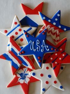 decorated cookies are arranged in the shape of stars and stripes with the word usa written on them