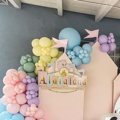 there is a castle with balloons on the wall