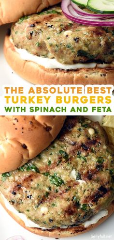 spinach and feta turkey burgers with cucumbers on the side are shown