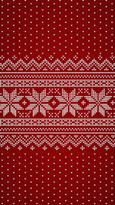 a red and white knitted pattern with hearts on the bottom, as if it were from a sweater