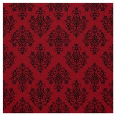 a red and black wallpaper with an ornate design