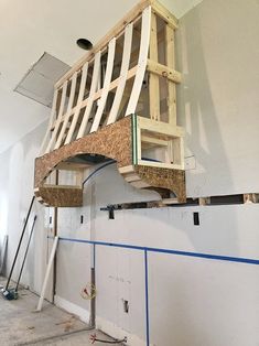 an unfinished staircase being built into the side of a building