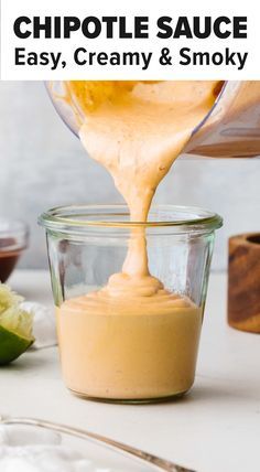 a person pouring sauce into a glass jar with the words chipotle sauce easy, creamy & smoky