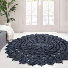 a large blue rug in front of a window