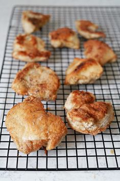 several pastries are cooling on a wire rack