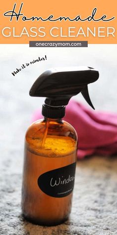 homemade glass cleaner bottle on the ground with text overlay that reads homemade glass cleaner