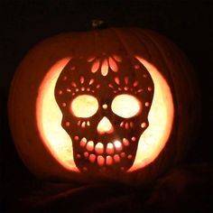 a carved pumpkin with a skull on it