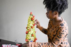 Six easy steps to create a festive fruit centerpiece for the holidays for less than a store-bought version! It's a great gift or edible centerpiece. #ediblearrangementideas #Christmascenterpieceideas #dashofjazzblog