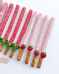 there are many strawberries and strawberrys made out of candy sticks