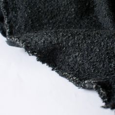 Snuggle up in this high end designer 100% wool Boucle sweater knit! This is fabric has a heavy weight and a mechanical stretch which will sew up a lovely sweater, cardigan, jacket or wrap. Close up photo. Black Soft Texture Sweater For Fall, Black Soft Textured Sweater For Fall, Soft Black Fall Sweater, Soft Black Sweater For Fall, Cozy Textured Knit Black Outerwear, Charcoal Wool Sweater For Fall, Cozy Black Textured Knit Outerwear, Charcoal Winter Sweater, Cozy Black Knit Outerwear