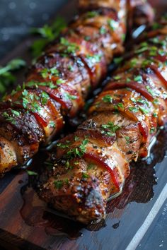 meat wrapped in bacon and garnished with parsley