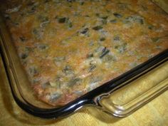 a casserole in a glass dish on a wooden table