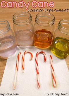 candy canes and jars filled with liquid on a paper towel next to some candy canes