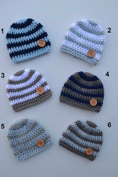 six crocheted hats with buttons on them