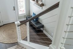 the stairs in this house are made of wood and white with metal handrails