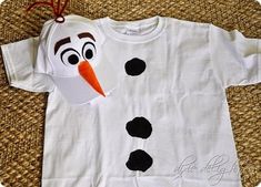 a t - shirt that has been made to look like a snowman with an orange nose