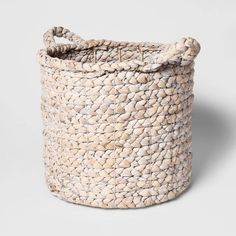 a white woven basket on a gray background