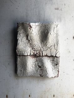 a piece of art that looks like cracked concrete