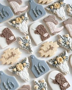 many decorated cookies are arranged on a table