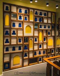 the shelves are filled with blue and yellow items