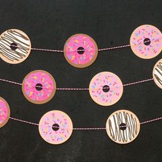 donuts and sprinkles are hung on a string