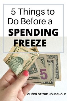 a hand holding money with the text 5 things to do before spending freeze queen of the household