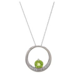 Metal Content: 10k White Gold Stone Information Natural Peridot Carat(s): .85ct Cut: Round Color: Green Natural Diamonds Carat(s): .03ctw Cut: Single Color: H - I Clarity: SI2 - I1 Total Carats: .88ctw Chain Style: Prince of Wales Necklace Style: Chain Fastening Type: Spring Ring Clasp Theme: Circle Measurements Item 1: Pendant Tall: 3/4" (18.7mm) Wide: 3/4" (18.4mm) Item 2: Necklace Length: 18 1/2" Width: 1/32" (0.7mm) Weight: 2.4 Grams Stamps: 10k, maker's mark, XL Condition: Pre-Owned Profess Diamond Circle Pendant, 2 Necklace, Circle Pendant Necklace, Circle Diamond, Gold Stone, Maker's Mark, Prince Of Wales, Circle Pendant, Necklace Length