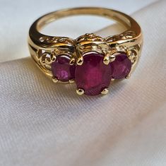 Pretty And Feminine 14k Solid Yellow Gold Ring Flower Motifs In Gallery Area Three Natural Oval Rubies With Many Visible Inclusions Sz 7, Sizable Weighs 4.8 Grams Ruby And Gold Ring, Victorian Ruby Ring In Yellow Gold With Intricate Design, Victorian Gold Rings With Ruby, Ornate Gold Rings With Ruby, Victorian Yellow Gold Ruby Ring, Gold Ring Flower, Ruby Promise Ring, Ruby Engagement Ring Vintage, Victorian Gold Ruby Ring With Multi-stone