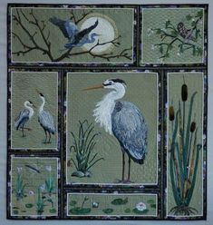 a quilt with birds and plants on it