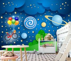 a child's room decorated in blue and green with stars, planets, and a bike on the wall