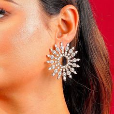 Make a bold fashion statement with our stunning Diamond Earrings from Agulka Jewels. The India-inspired design showcases intricate craftsmanship and cultural richness. The sunburst pattern adds a touch of radiance, making these earrings a captivating focal point. Perfect for bridal weddings or special events, these statement studs exude elegance and sophistication. Embrace the allure of oversized studs and elevate your style with these exquisite earrings. Let Agulka Jewels be your go-to destinat Celebrity Earrings, Celebrities Earrings, Earrings Bridesmaid, Statement Earring, Inspirational Celebrities, Silver Crystal, American Diamond, Large Earrings, Cz Diamond