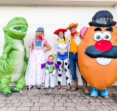 a group of people standing next to each other in costumes