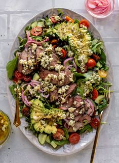 a salad with meat and vegetables on a plate