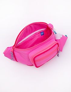 Our Fanny Sling is the cross body bag you've been waiting for! This silhouette hugs your body in all the right places and is the perfect medium size that will hold your necessities without weighing you down. Features super soft match nylon webbing, tonal piping details, match buckle, a padded exterior for extra comfort and insulation, 3 separate zipper compartments, and two additional pockets in the main compartment. Coordinating paracord pulls make opening this bag a cinch! Comes with a matchin Sporty Nylon Belt Bag For On-the-go, Nylon Crossbody Bag With Water Bottle Pocket, Nylon Shoulder Bag With Functional Pockets For School, Functional Nylon Belt Bag For On-the-go, Functional Pink Nylon Bags, Nylon Crossbody Belt Bag With Removable Pouch, Sporty Nylon Belt Bag With Removable Pouch, Functional Nylon Belt Bag With Adjustable Strap, Sporty Nylon Belt Bag With Zipper Closure