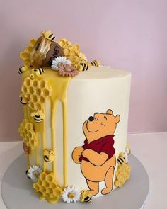 a winnie the pooh cake with honey dripping from it