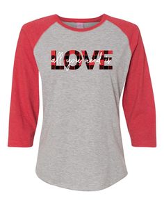 a women's baseball shirt with the word love on it in red and grey