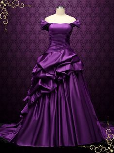 a purple dress is displayed on a mannequin