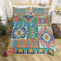 an image of a colorful bed set on the floor