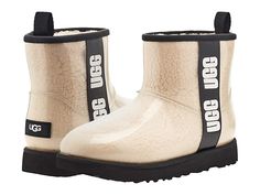 UGG Classic Clear Mini - Women's Shoes : Natural/Black : The UGG Classic Clear Mini ankle boot is here so you can have a little fun with your look! Features a curly faux-shearling enclosed by a translucent TPU molded upper and rubberized graphic logo strap at side. Offers a round toe with an easy pull-on design and heel tab. Added warmth with 7mm of UGGpure wool linings and foam footbed. Cold-weather rated to -20°C. Treadlite by UGG outsole provides increased traction, durability, cushioning and Ugg Classic Clear, Ugg Classic Mini Ii, Womens Ugg, Ugg Classic Tall, Ugg Classic Ultra Mini, Ugg Mini, Ugg Classic Mini, Black Uggs, Waterproof Winter Boots