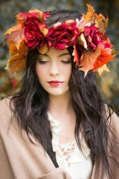 a woman with long hair wearing a flower crown