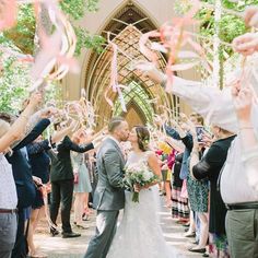 a bride and groom are surrounded by confetti