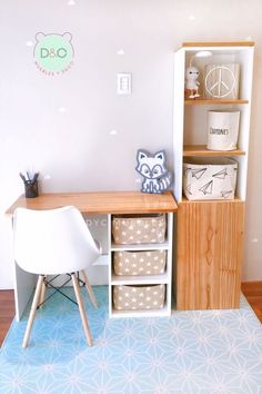 a room with a desk, chair and bookshelf on the floor in front of it