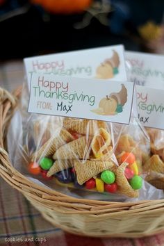 a basket filled with happy thanksgiving cheetos next to a sign that says happy thanksgiving